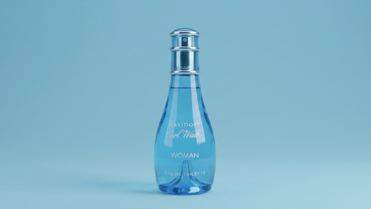 Blue perfume bottle on a light blue background