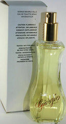 Giorgio Beverly Hills Eau de Toilette in a clear bottle with gold accents next to its box.