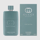 Gucci Guilty Love Edition perfume for men in a sleek teal bottle with matching box, showcasing an earthy and woody scent.